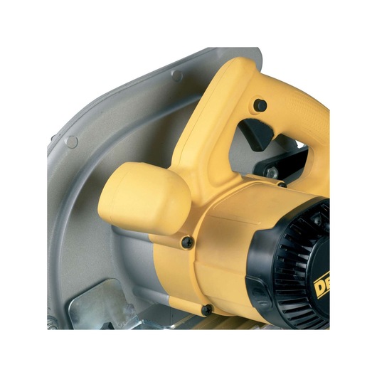 Close-up of a yellow DEWALT circular saw handle and motor housing. The saw features a textured ergonomic handle and a robust build, suitable for professional woodworking and construction tasks.