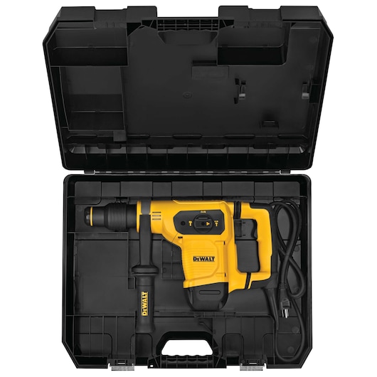 A yellow and black DEWALT rotary hammer drill with a side handle and attached power cord, neatly placed inside an open black carrying case.