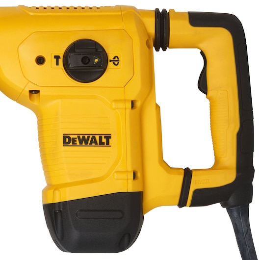 Close-up view of a DEWALT yellow and black power tool, showing the handle, controls, and the brand logo on the body. This equipment is typically used for construction or demolition tasks.