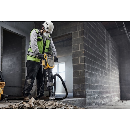 DEWALT D25966K, D25966-B2 breaker in use at construction site, worker in safety gear breaking concrete.