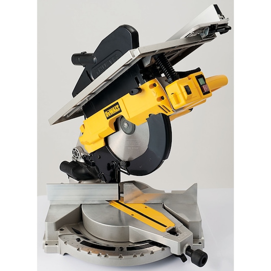 A DEWALT D27113 compound miter saw with a yellow and black design, shown angled upward, featuring a circular blade and a metal base with measurement markings.
