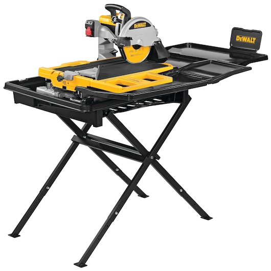A DEWALT branded tile saw with a yellow and black color scheme, mounted on a folding stand. The saw features a round blade, adjustable guides, and water trays for wet cutting, intended for precision tile work.