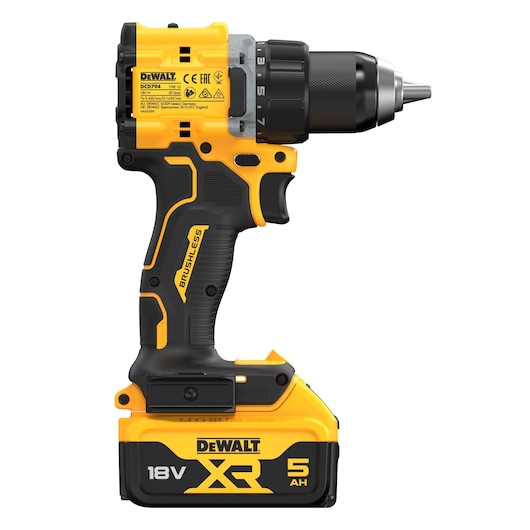 A DEWALT cordless drill, model DCD794P2T, featuring an 18V XR lithium-ion battery with 5 Ah capacity. The drill is yellow and black, has a brushless motor, and includes labeling and branding details.