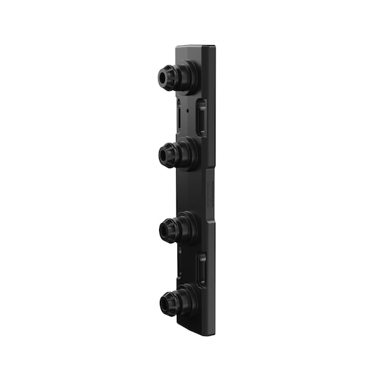 A black plastic DEWALT accessory component with four evenly spaced circular connectors protruding from one side, photographed against a plain white background.