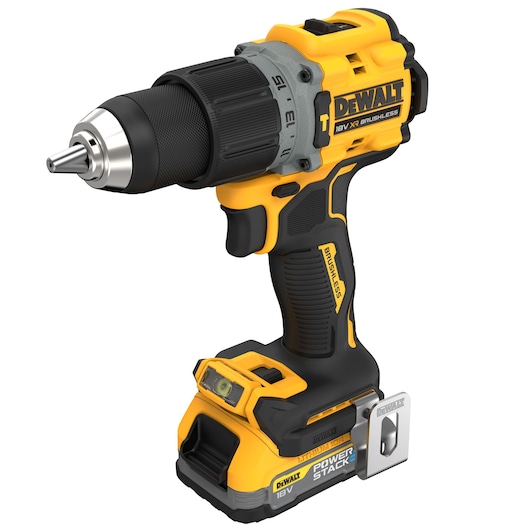 A DEWALT 18V XR brushless cordless drill with PowerStack battery, shown in yellow and black with a metal belt clip and ergonomic handle.