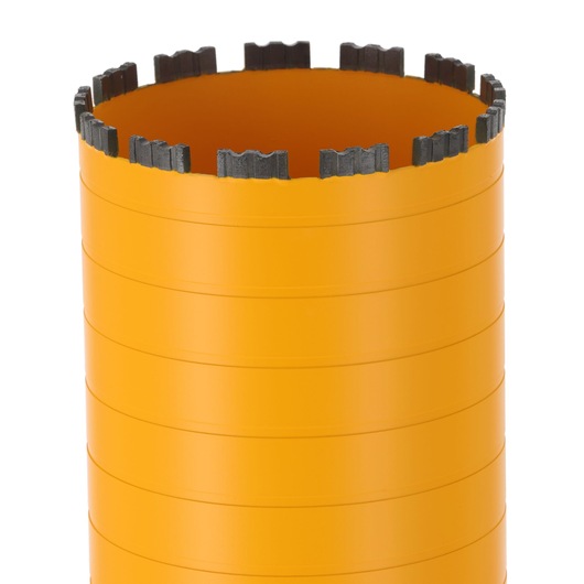 Close-up of a DEWALT cylindrical orange core drill bit with segmented cutting edge.