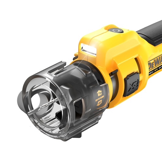 Close-up of a DEWALT cordless rotary tool with a yellow and black body, a transparent protective cover, a drill bit attachment, and an LED work light near the top.