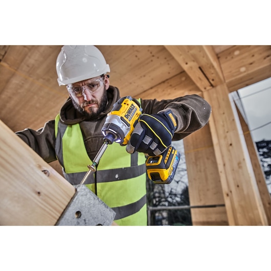Worker uses DEWALT photography tool. SKUs: DCZ507T2-XE, DCZ407P1T1-XE, DCZ607X2-XE, DCZ503X2-XE, DCF860N.