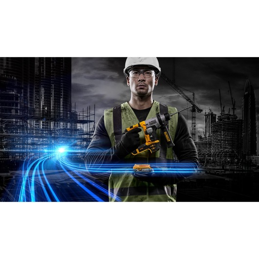 A person wearing a safety vest and helmet holds a DEWALT cordless rotary hammer drill (model DCH172E2T) against a construction site background with modern buildings, cranes, and blue light streaks representing energy or technology. The person's face is blurred.