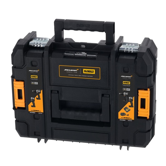 A black and orange DEWALT branded tool case with two latches, a sturdy handle, and detailed product stickers indicating compatibility with power tools. The label shows a partnership with McLaren and highlights the model DCK200MM2T.