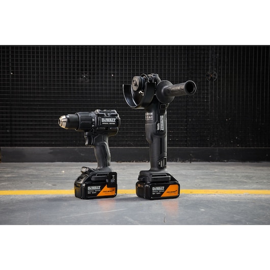 DEWALT tools, SKUs DCK2223MP2T-QW, DCK2223MP2T, photography category, cordless drill and grinder on floor.