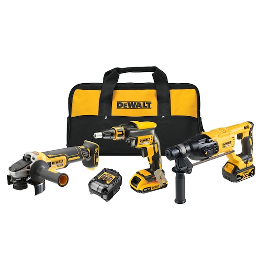 A DEWALT tool kit containing three cordless power tools, a yellow and black carrying bag, and a battery pack. The tools include an angle grinder, a drywall screwgun, and a rotary hammer.