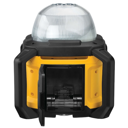 Front view of a DEWALT DCL074 portable work light with a black and yellow protective casing and an access door open at the bottom for battery installation.