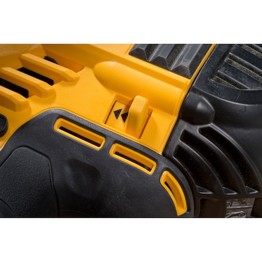 Close-up of a yellow and black DEWALT power tool showing vent and adjustment lever.