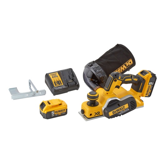 A DEWALT cordless planer set including a yellow and black electric planer with dust bag, two 18V 5Ah XR lithium-ion batteries, a charger, and a metal guide accessory.
