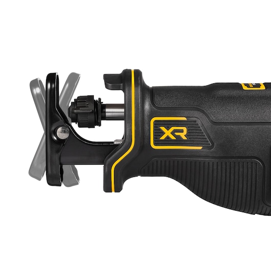 Close-up of a DEWALT XR cordless reciprocating saw, showing the blade attachment area and the ergonomic black and yellow handle.