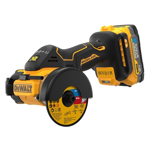 A DEWALT cordless brushless cut-off tool with an 18V Power Stack battery and a protective guard around the cutting disc. The tool is yellow and black with DEWALT branding and safety labels visible on the disc.