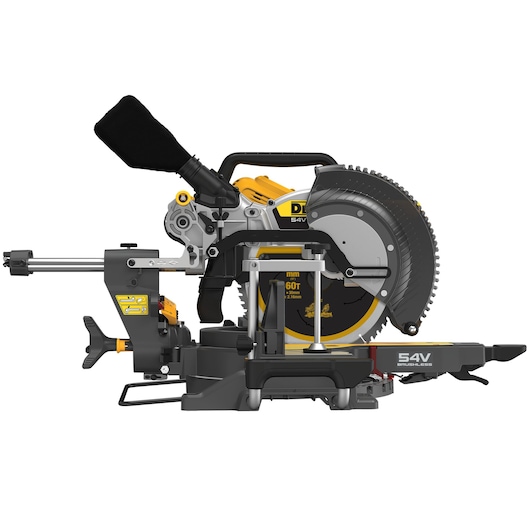 A DEWALT 54V brushless sliding compound mitre saw, model DCS781N, shown from the side with its circular blade, dust collection bag, and adjustable arm. The saw features a robust construction with yellow and black accents.