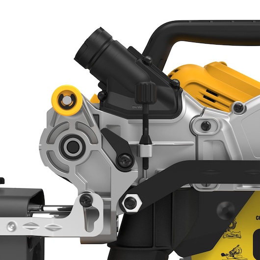 Close-up view of a DEWALT DCS781X2 power tool, showing detailed components including adjustment knobs, metal framework, and part of the handle in yellow and black colors.