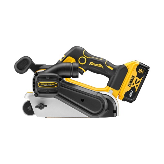 A DEWALT cordless belt sander with yellow and black design, featuring an 18V XR 5Ah lithium-ion battery and brushless motor. The tool is shown from the side on a white background.