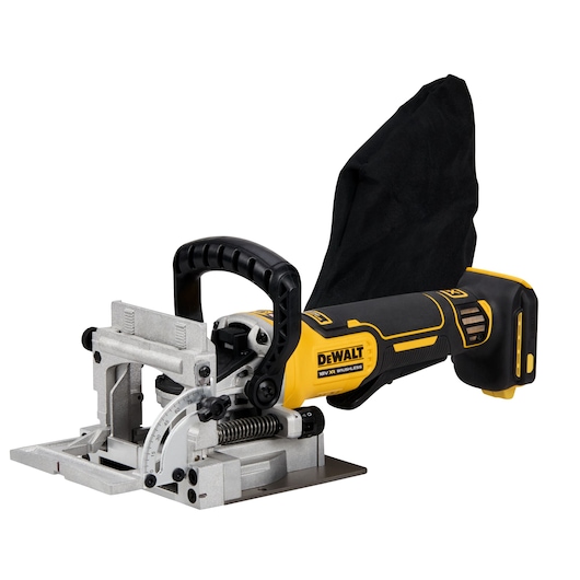 Cordless DEWALT biscuit joiner with a yellow and black body, ergonomic handle, metal cutting base, and attached dust bag, used for woodworking.