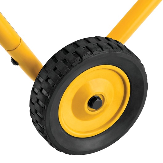 Close-up view of a black and yellow wheel attached to a yellow metal frame, likely part of a tool stand or similar equipment.