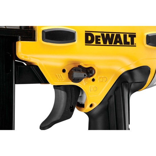 Close-up of the DEWALT DPSSL540 photography tool trigger and control switch with yellow and black design.