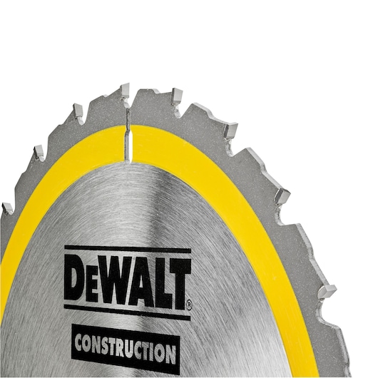 Close-up view of a DEWALT construction circular saw blade with a yellow rim and visible teeth.