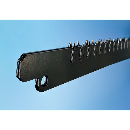 Close-up of a black saw blade with sharp teeth, shown against a blue background.