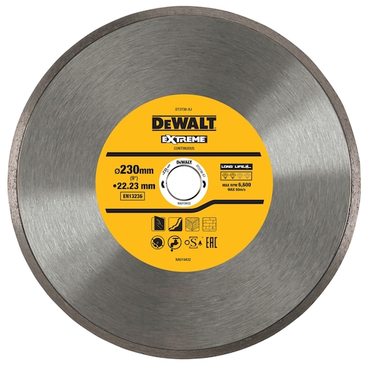 DEWALT Extreme DT3738 continuous diamond cutting disc with a diameter of 230 mm and a bore size of 22.23 mm, designed for use on construction materials. The center part displays product specifications, safety icons and usage information, set against a yellow background.