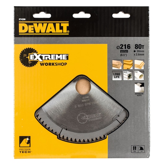 DEWALT DT4286 Extreme Workshop circular saw blade in packaging. The circular blade has 80 teeth, a diameter of 216 mm (8.5 inches), a 30 mm bore, and is 2.6 mm thick. The packaging is yellow and gray with product details, icons showing compatible materials such as plywood, laminate, aluminum, and PVC, and mentions features like long life and precision technology.