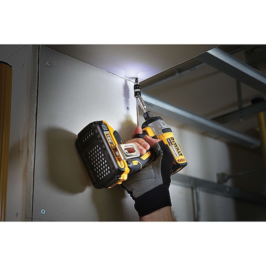 DEWALT drill in use, with glove, SKU DT70578T, DT70578T-QZ. Photography product category.