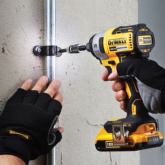 DEWALT DT70578T, DT70578T-QZ used for screwing metal bracket to wall. Photography category. EMEAANZ region.