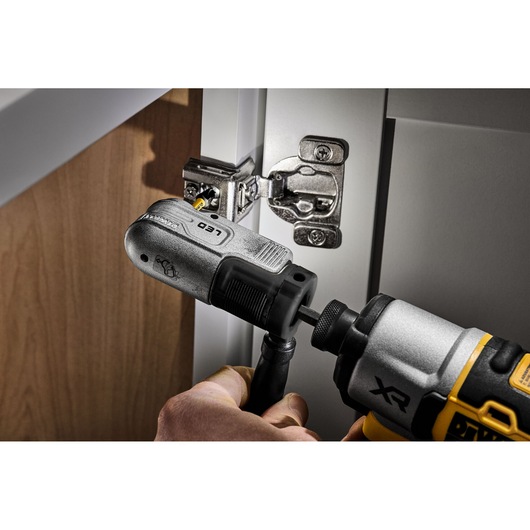 DEWALT right angle attachment used with a drill to install a cabinet hinge in tight space.