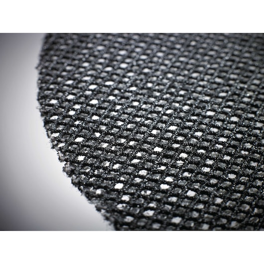 Close-up of a round DEWALT mesh sanding disc with a grid pattern and rough texture.