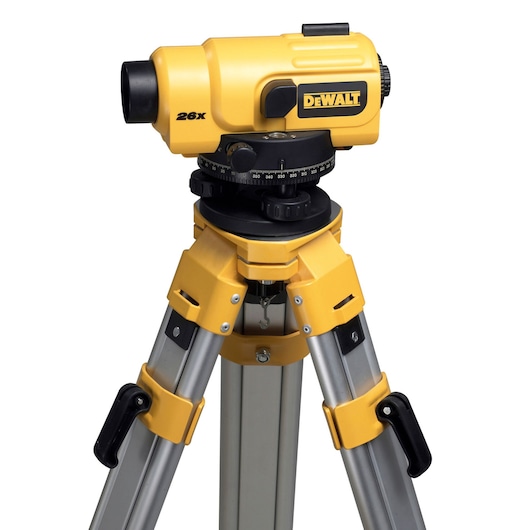 DEWALT DW096PK optical level on tripod. Yellow and black, used for precise construction measurements.