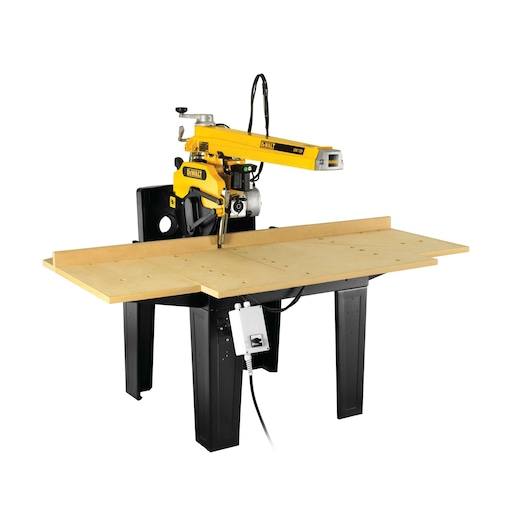 A DEWALT radial arm saw (model DW729KN) featuring a yellow arm, mounted on a black metal stand with a large wooden table surface. The saw is designed for precise woodworking and cutting tasks.