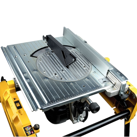 Close-up view of a DEWALT DW743N table saw featuring a silver metal top, a black blade guard, and a yellow base. The table saw is used for precise cutting of wood or other materials.