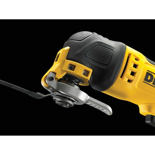 Close-up view of a DEWALT DWE315 oscillating multi-tool, showing the blade attachment and part of the yellow and black handle against a black background.