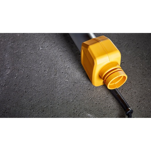 DEWALT DWE7800, DWE7800-QS: yellow tool part on textured surface, photography category.