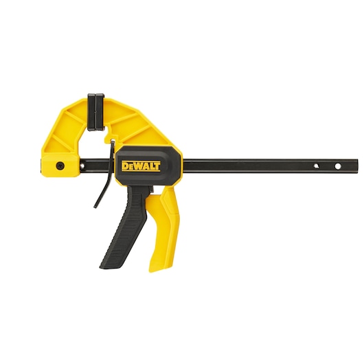 A DEWALT trigger clamp with yellow and black design, used for holding materials securely in place during woodworking or other projects.