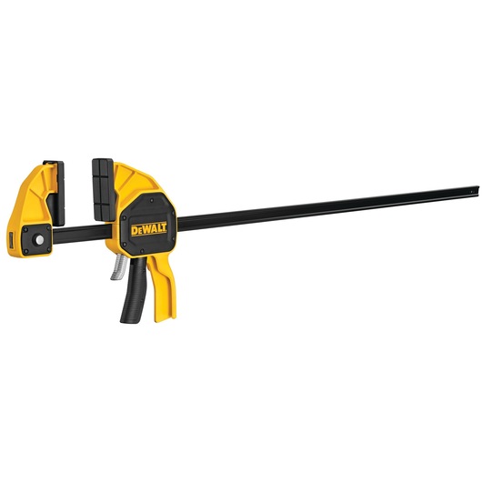 DEWALT trigger clamp with yellow and black body, used for securing materials during woodworking or construction.