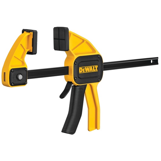DEWALT yellow and black trigger clamp with padded jaws for holding materials securely during work.