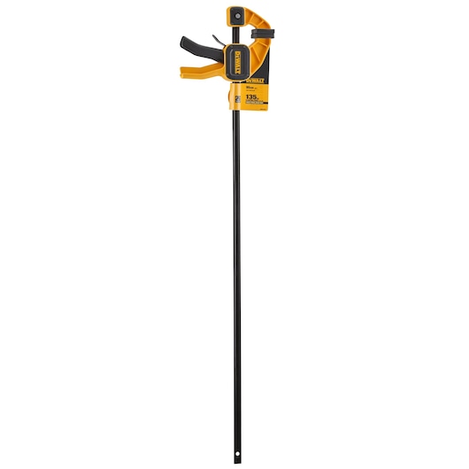 DEWALT bar clamp with trigger handle, black and yellow, used for securing materials during woodworking.