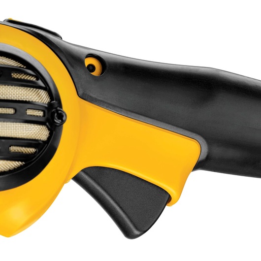Close-up view of the handle and trigger of a DEWALT DWP849X power tool, showing yellow and black plastic components and part of a ventilation grille.