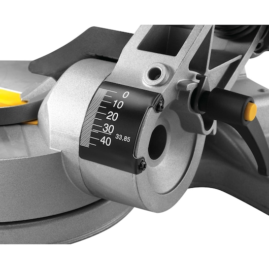 Close-up view of the DEWALT DWS778 mitre saw angle adjustment scale and locking knob, showing detailed measurement markings from 0 to 40 degrees.