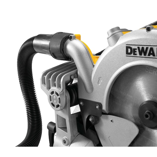 Close-up image of a DEWALT power saw, showing the blade and dust extraction hose attachment.