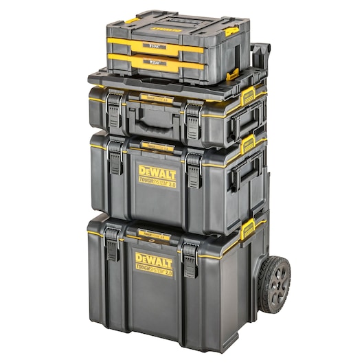 Stack of DEWALT ToughSystem 2.0 black and yellow tool storage boxes, including wheeled base and various sized containers, designed for rugged and portable organization.