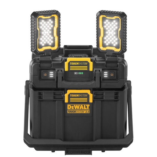 A DEWALT ToughSystem 2.0 portable storage box with two built-in LED work lights on top. The box is black and yellow, designed for durability and heavy-duty use, and features locking mechanisms and handles for easy transport.