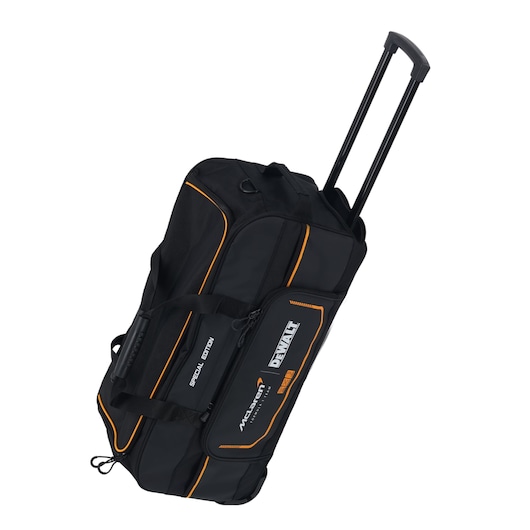 Black DEWALT wheeled duffel bag with orange trim, telescopic handle, and special edition branding visible.